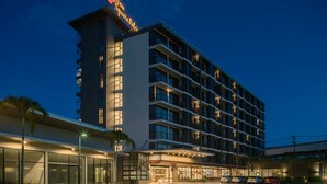 A multi-story hotel with a prominent sign reading "New Square Palace." - New Square Patong Hotel (Patong)