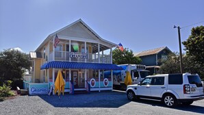 A building with a sign reading "Blue Mountain Beach Creamery" and an American flag. - Sunseeker - Xanadu by Coastal Dreamin (Santa Rosa Beach)