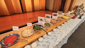 A buffet table with various dishes and labels in a hotel setting. - Sanriku Hana Hotel Hamagiku (Otsuchi-cho)