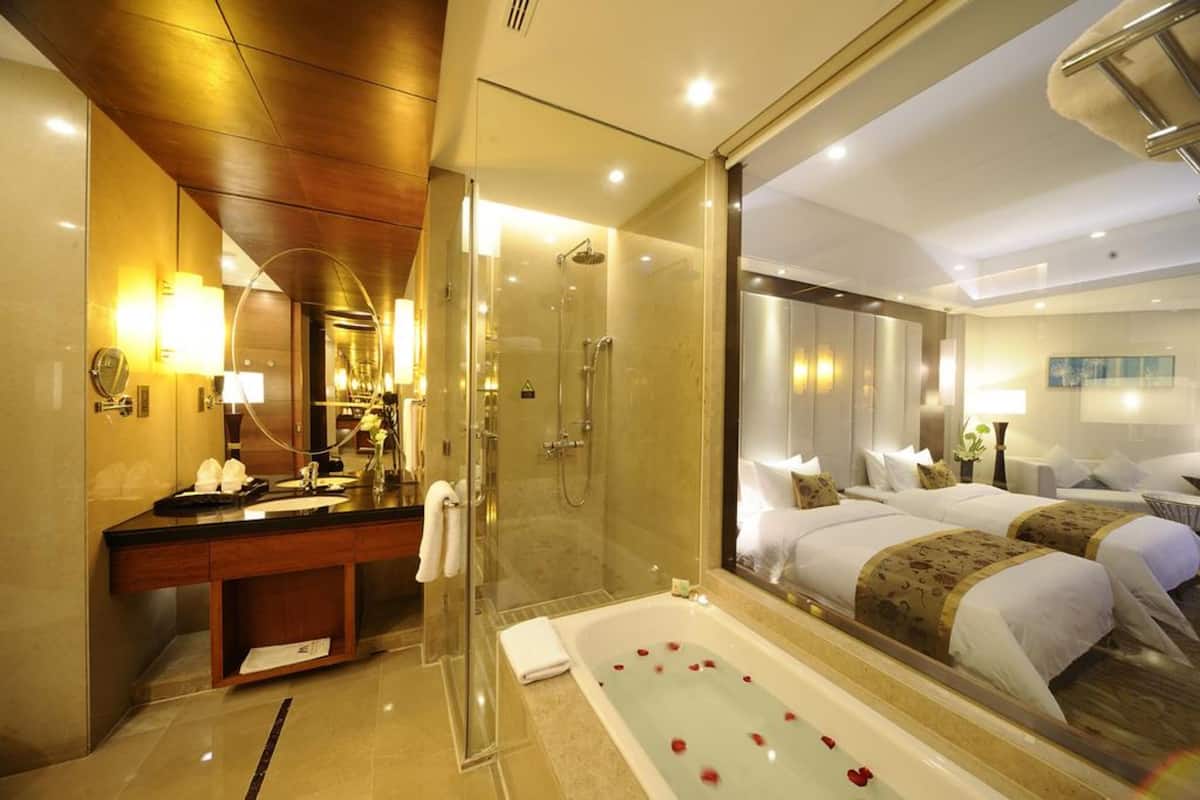 separate bathtub and shower, hair dryer, slippers, towels