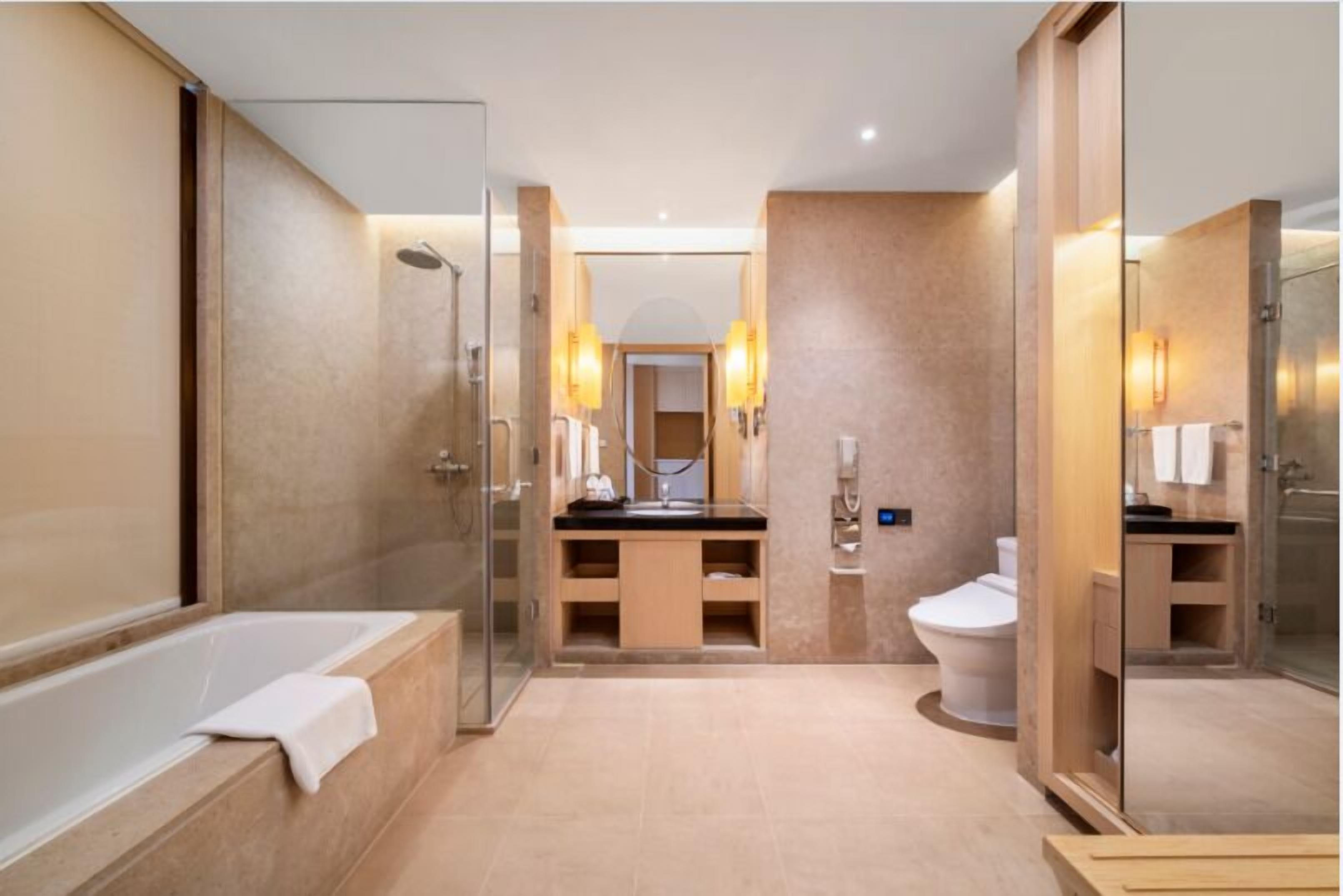 separate bathtub and shower, hair dryer, slippers, towels