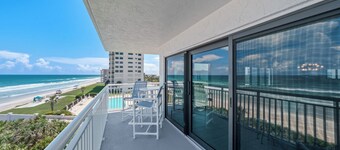 Direct oceanfront southern corner condo with large wrap-around balcony and heated pool