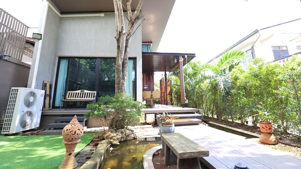 A modern house with a pool, a wooden deck, and a garden. - The White Elephant Home (Chiang Mai)