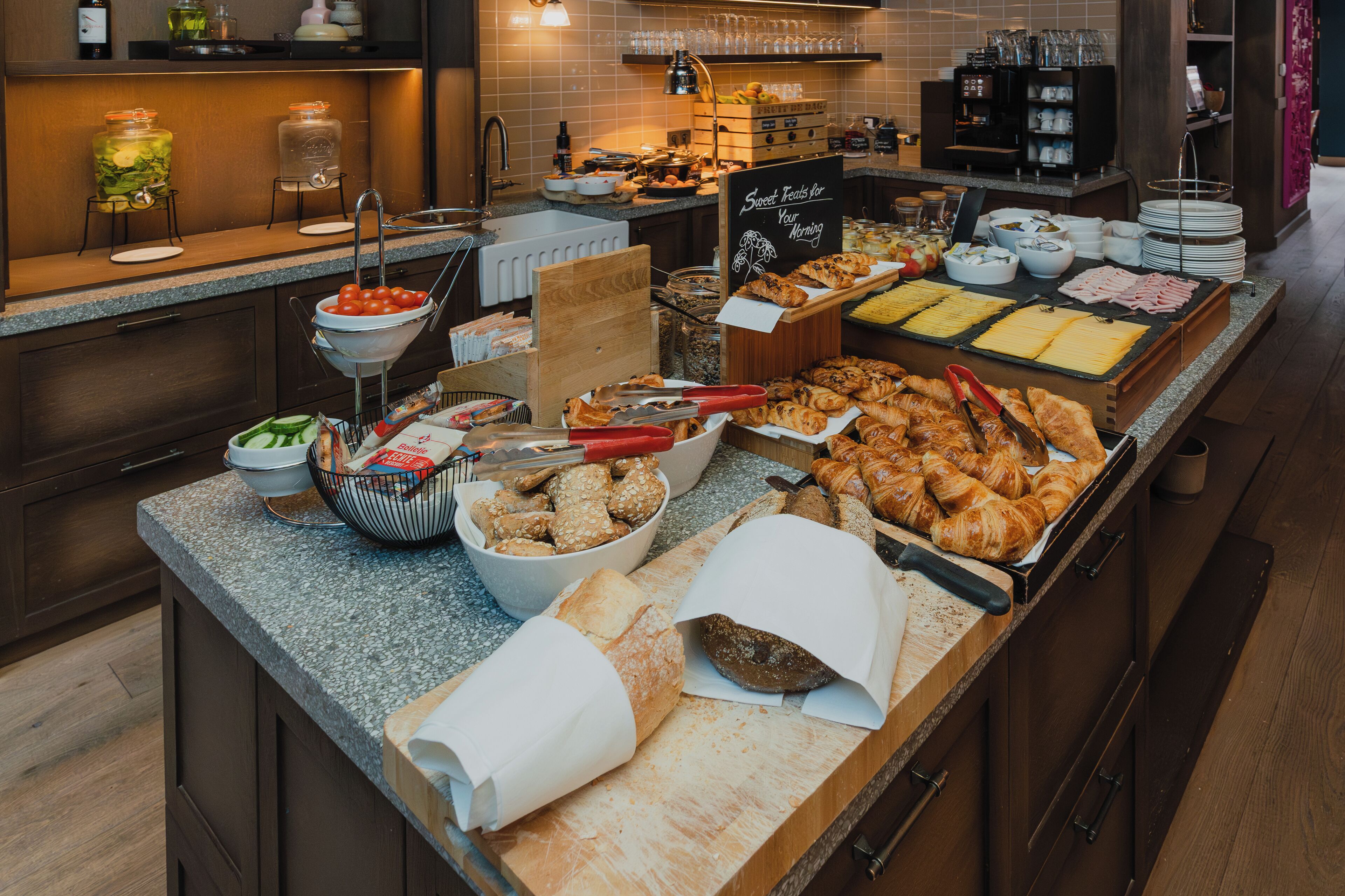 A buffet with various food items and condiments.