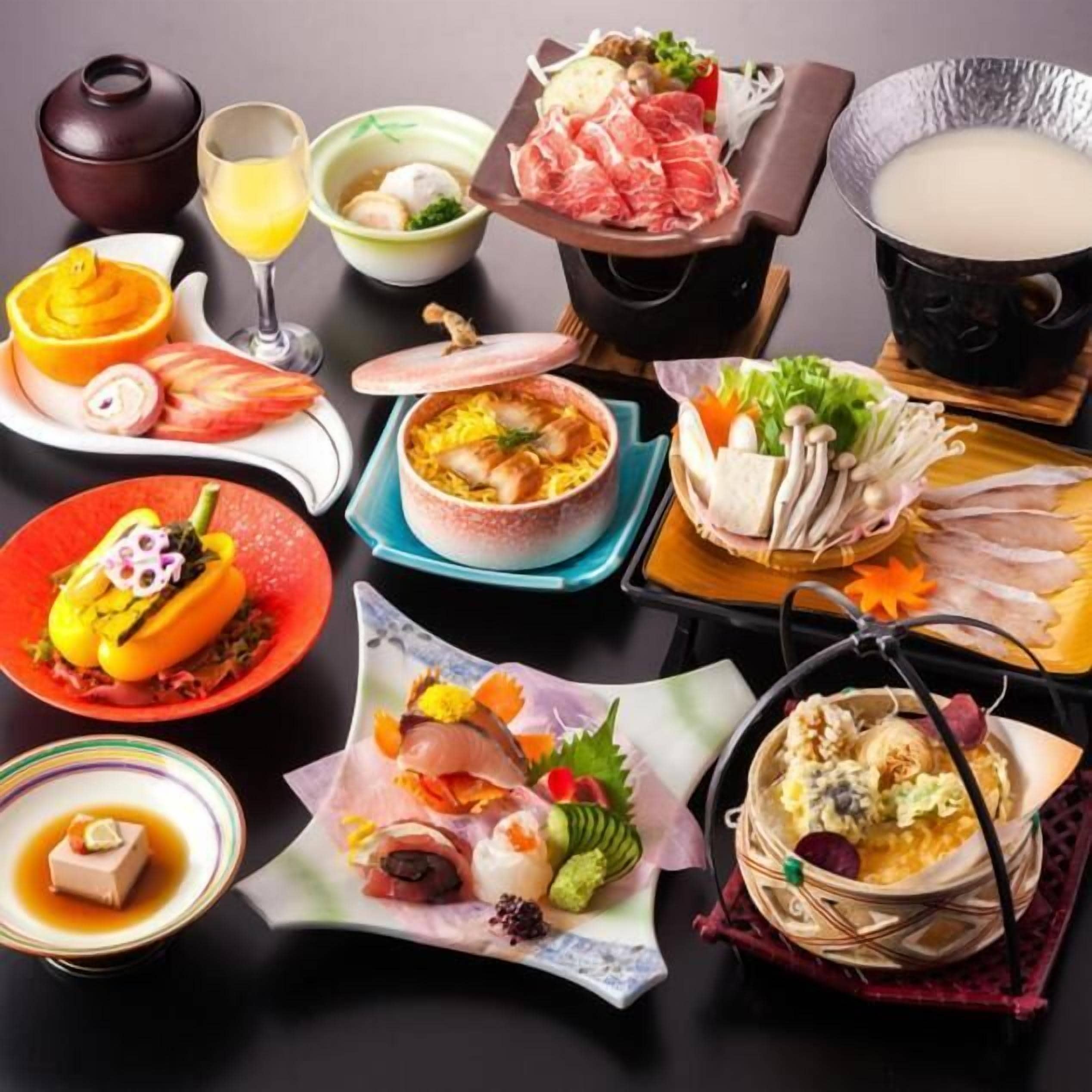 A variety of Japanese dishes including sushi, sashimi, and hot pot.