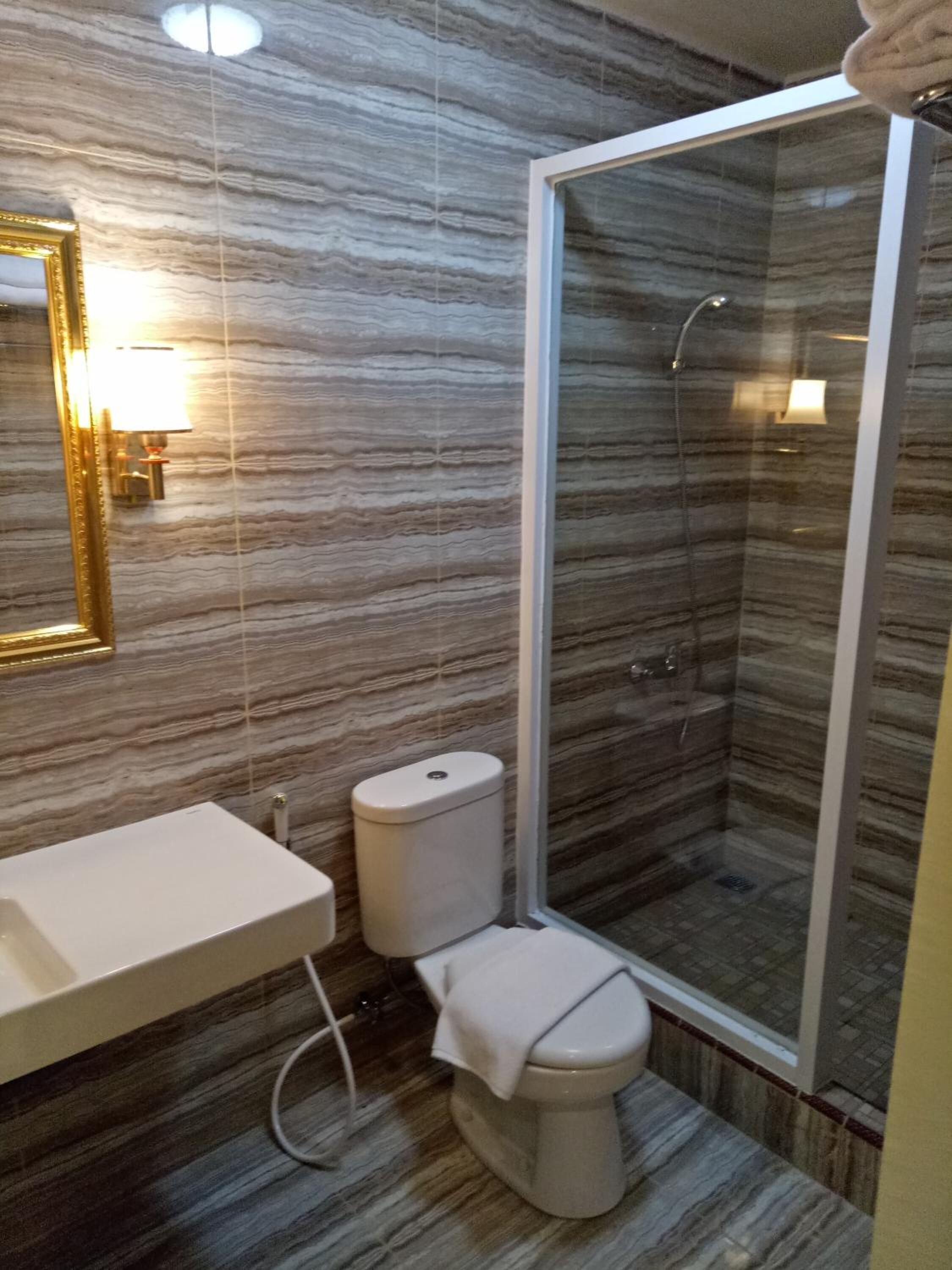 shower, free toiletries, slippers, towels