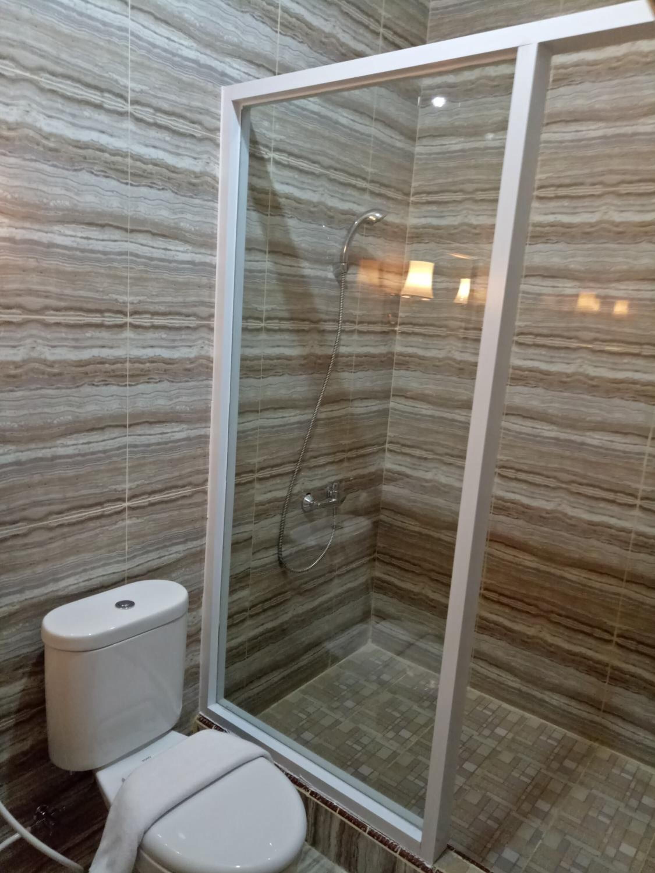 shower, free toiletries, slippers, towels