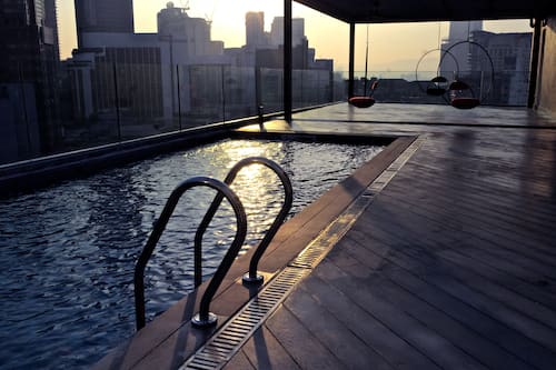 Outdoor pool, open 7:00 AM to 10:00 PM, pool loungers