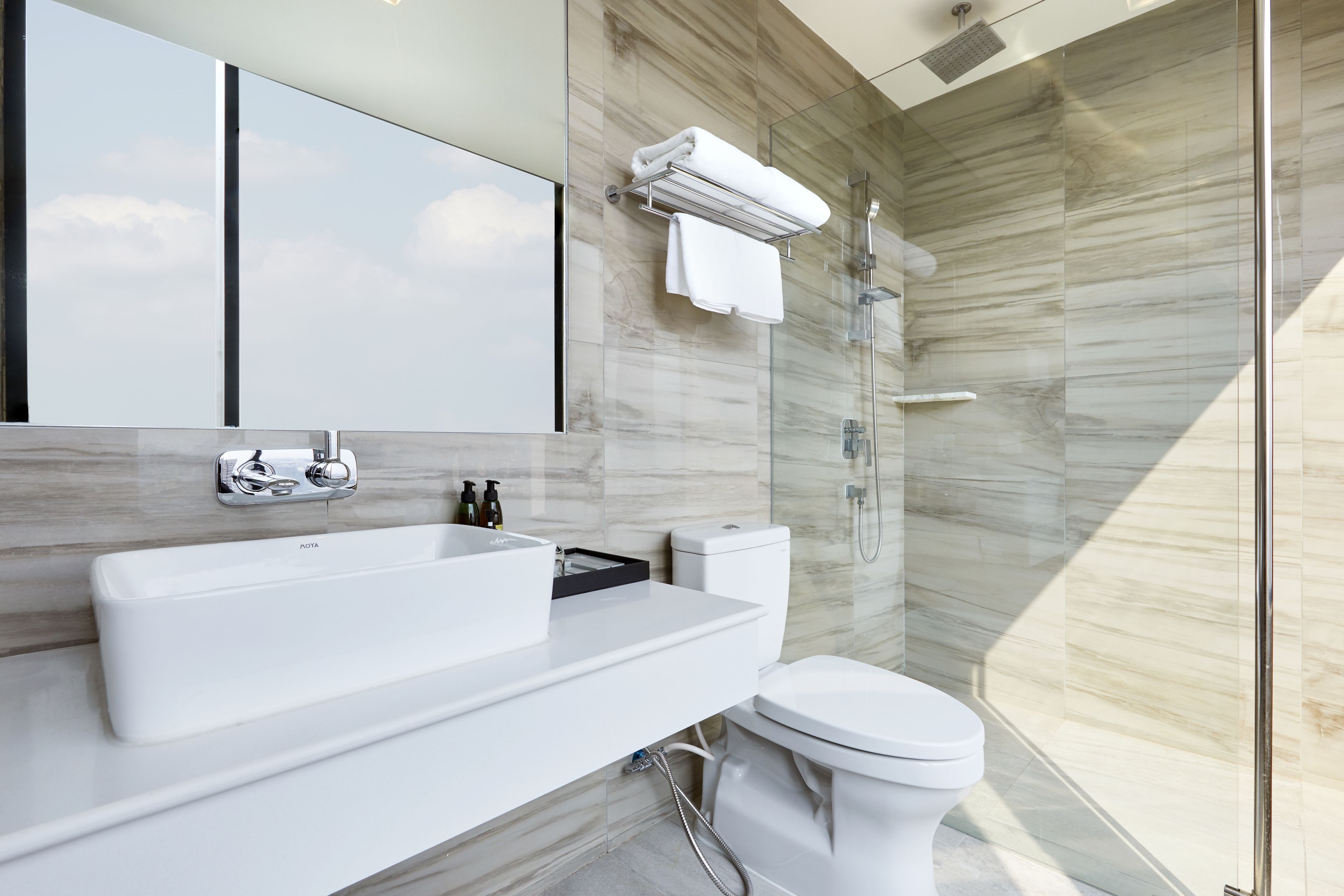 designer toiletries, hair dryer, bathrobes, slippers