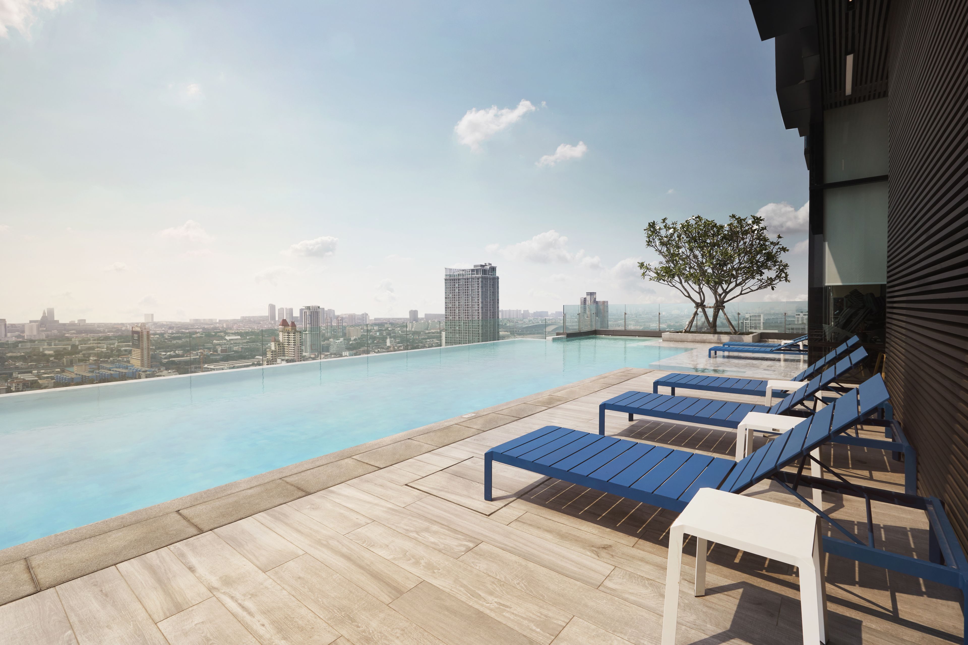 Outdoor pool, open 6 AM to 10 PM, pool loungers