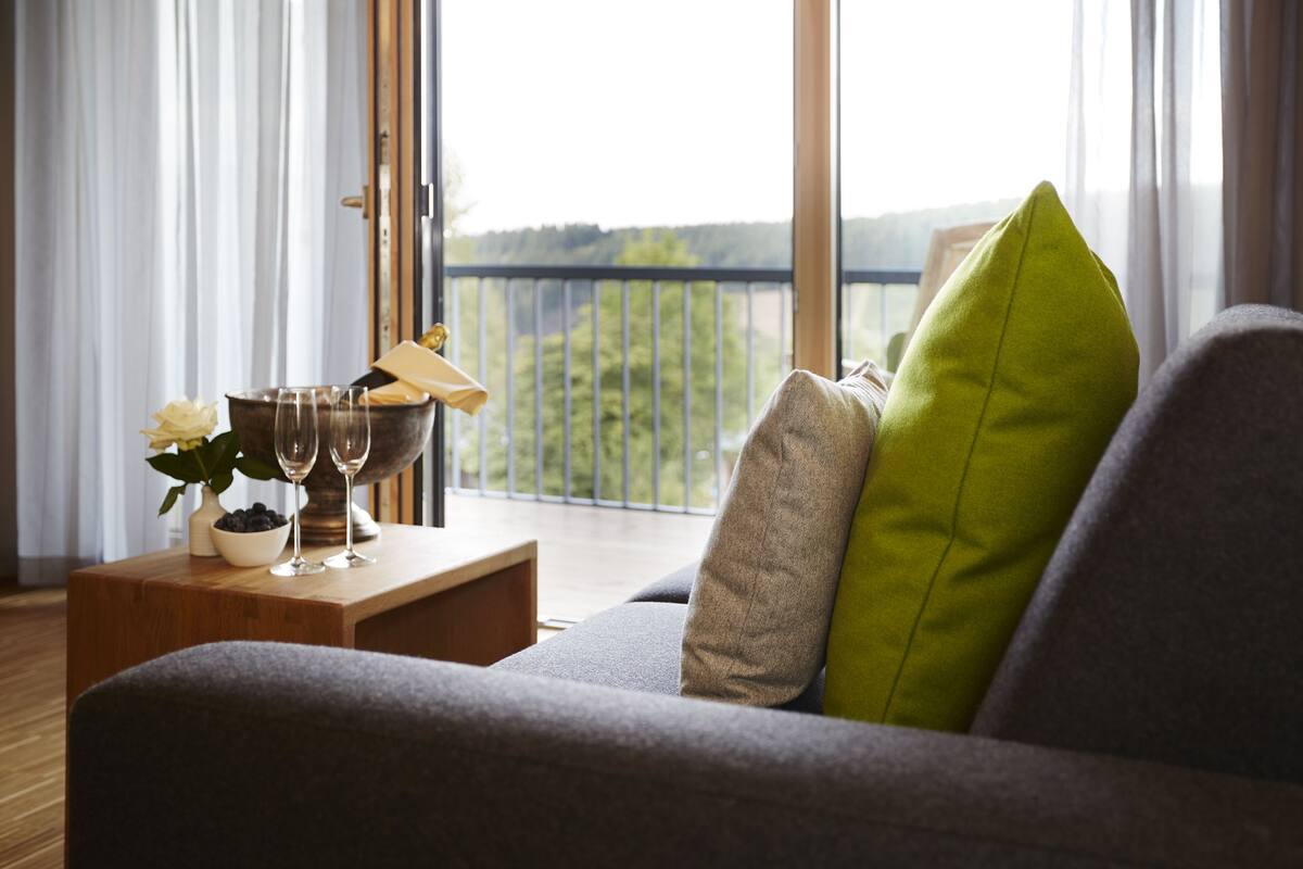 comfort double room (plus) | living area | flat-screen tv