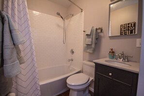 Combined shower/tub, hair dryer, towels, soap