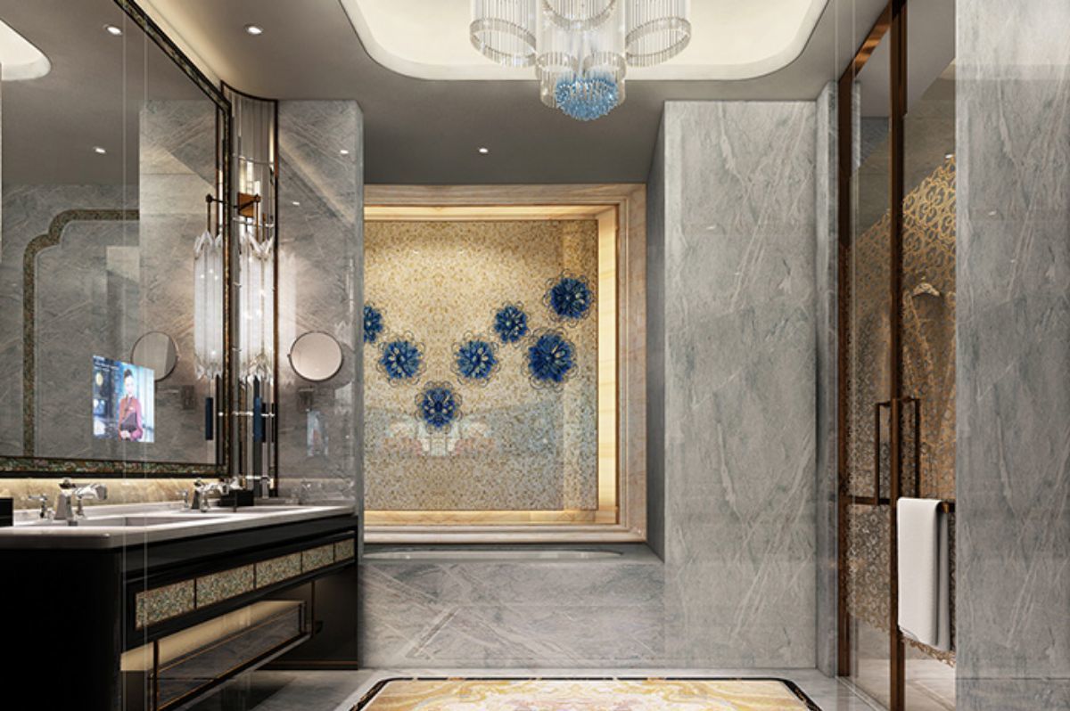 A modern bathroom with a large mirror, a sink, and a decorative wall with blue floral patterns.