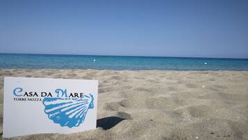On the beach, white sand, 2 beach bars
