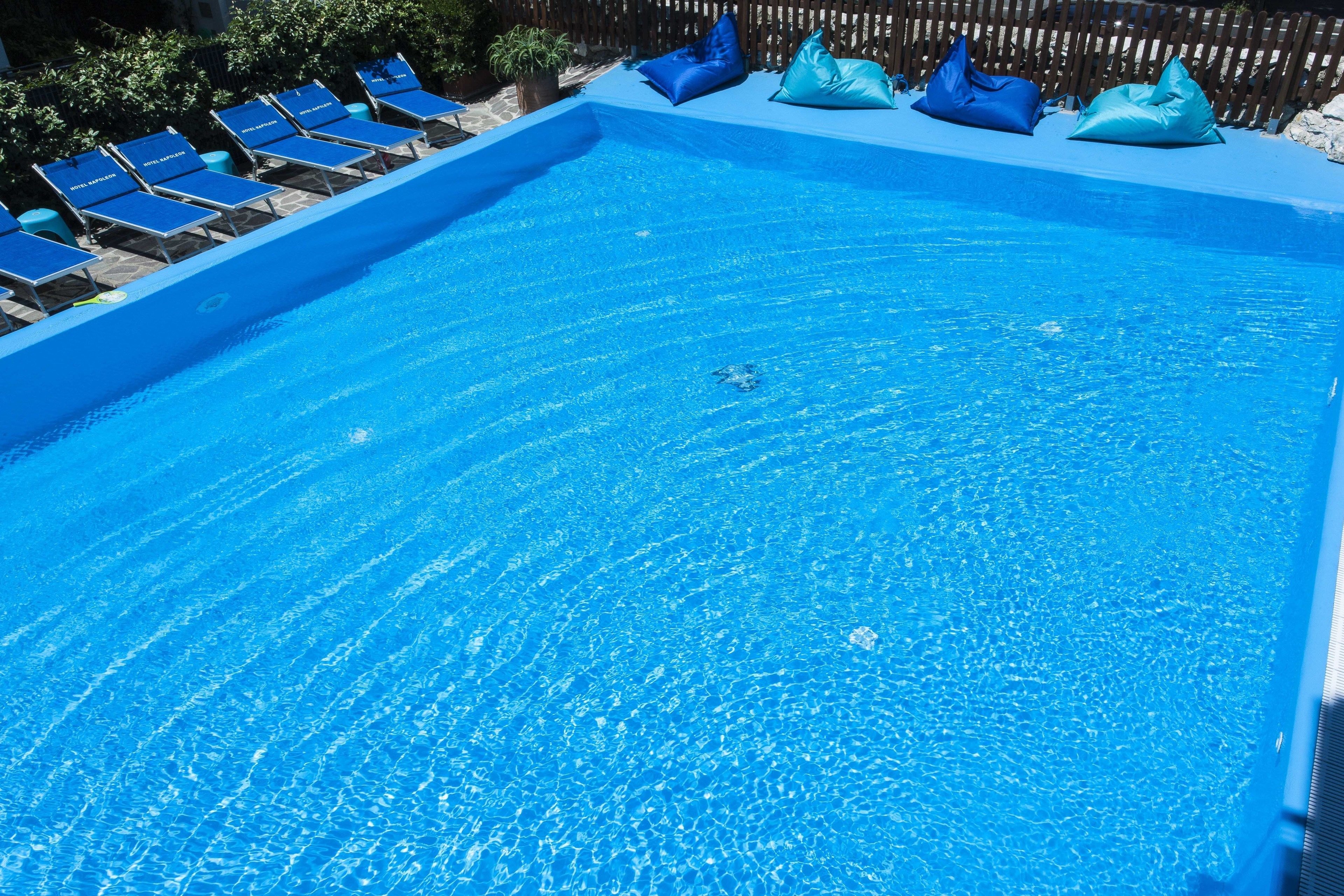 seasonal outdoor pool, an infinity pool, pool loungers