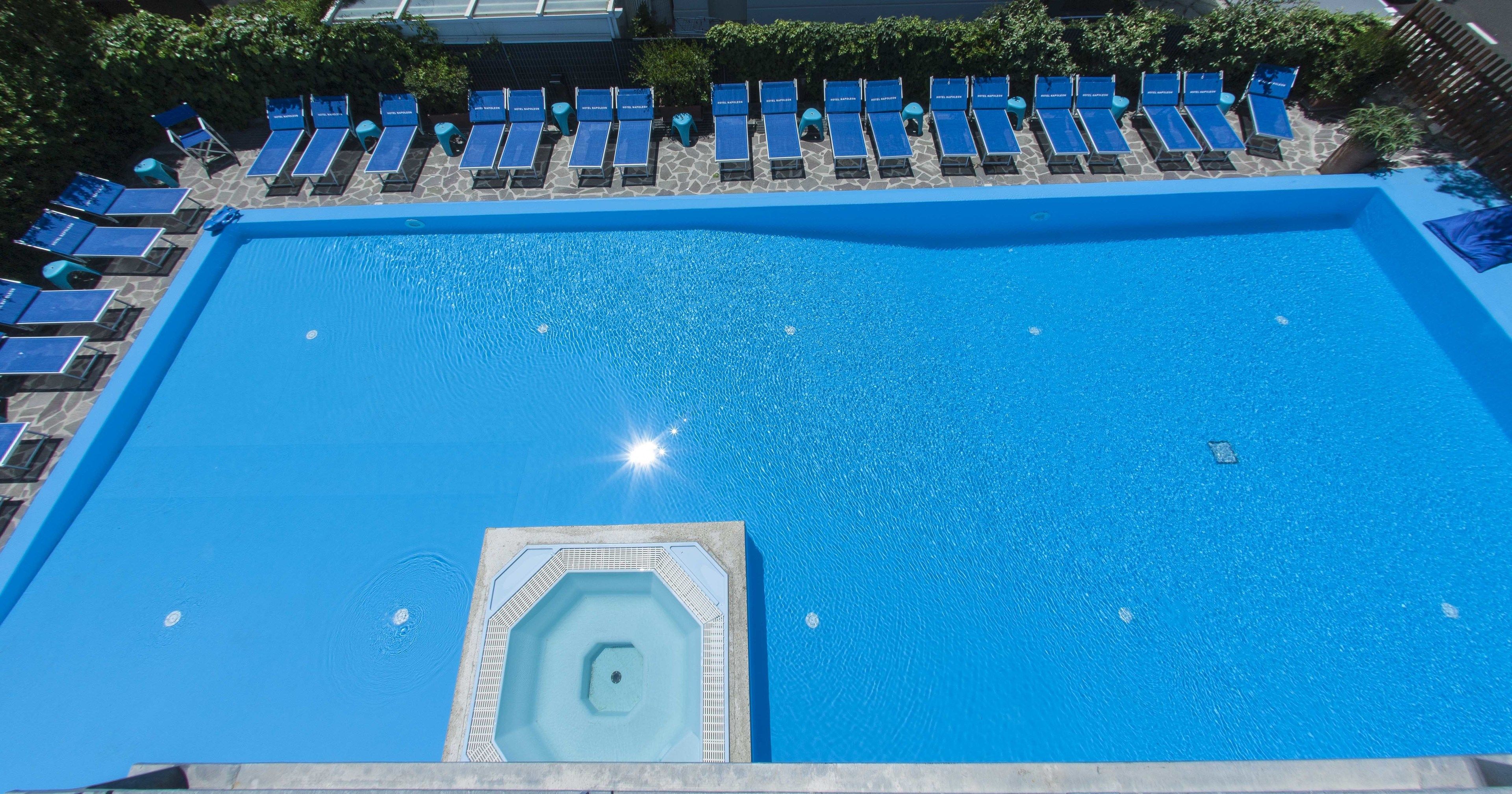 seasonal outdoor pool, an infinity pool, pool loungers