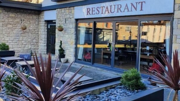 A restaurant with a stone facade and large windows. - Wessex Hotel (Street)