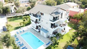 Seasonal outdoor pool, pool umbrellas, pool loungers