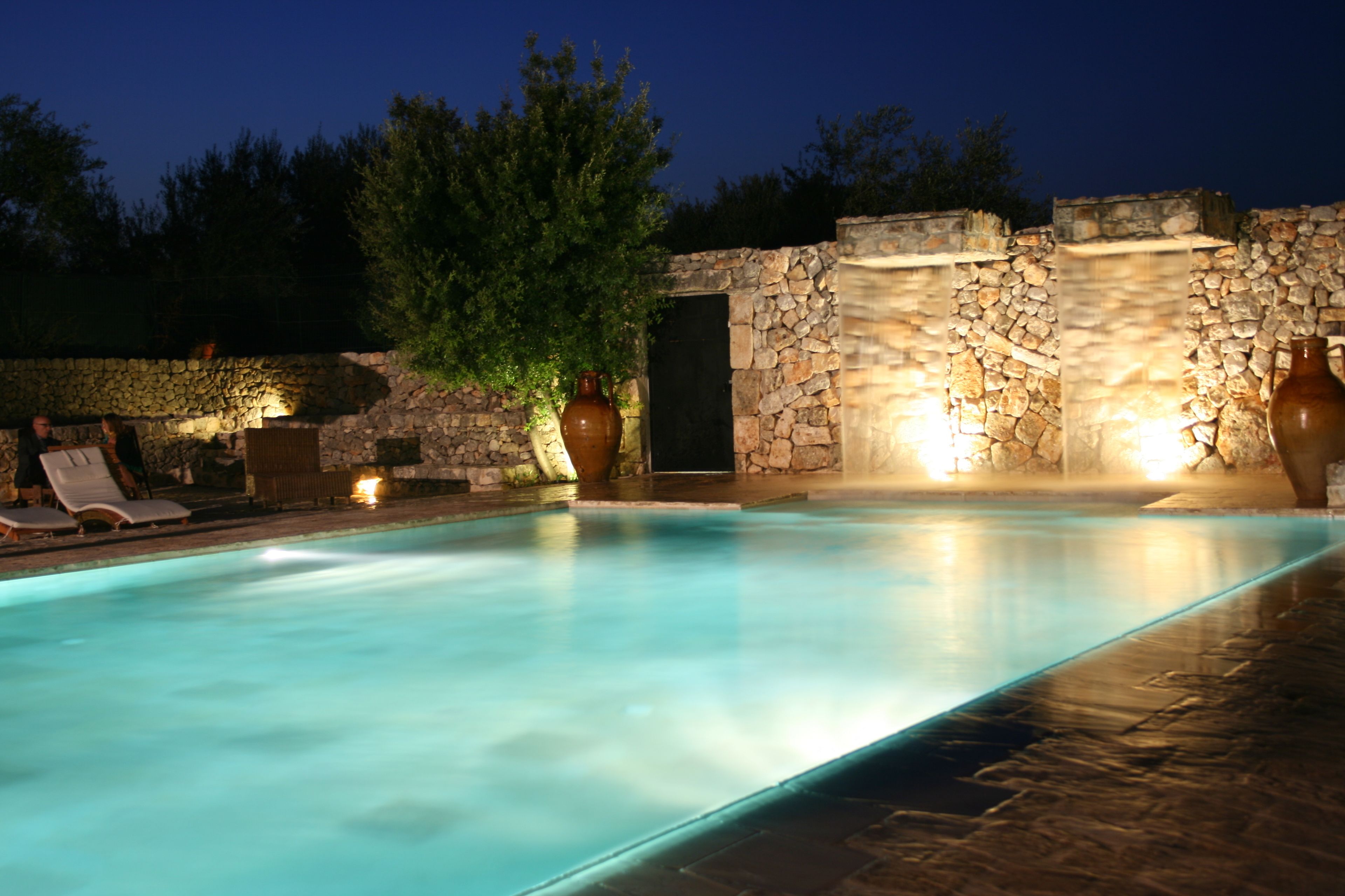 Outdoor pool, a waterfall pool, sun loungers