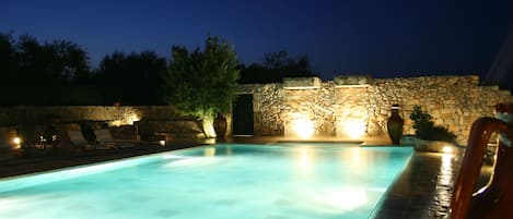 Outdoor pool, a waterfall pool, pool loungers