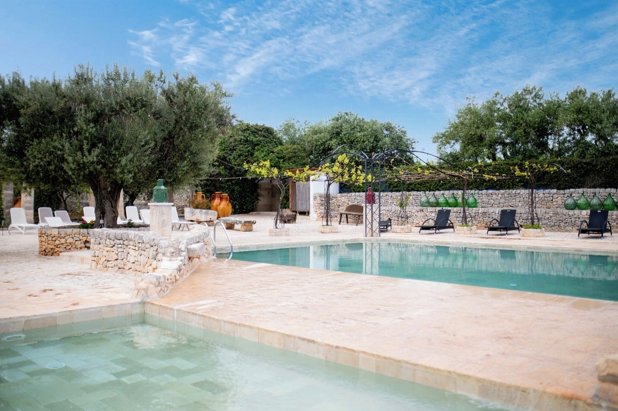 Outdoor pool, a waterfall pool, sun loungers
