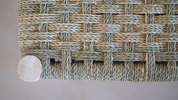 A close-up of a woven wicker wall panel.