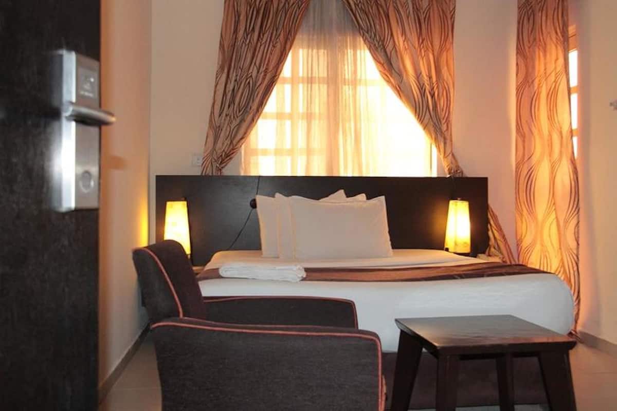 In-room safe, desk, laptop workspace, bed sheets
