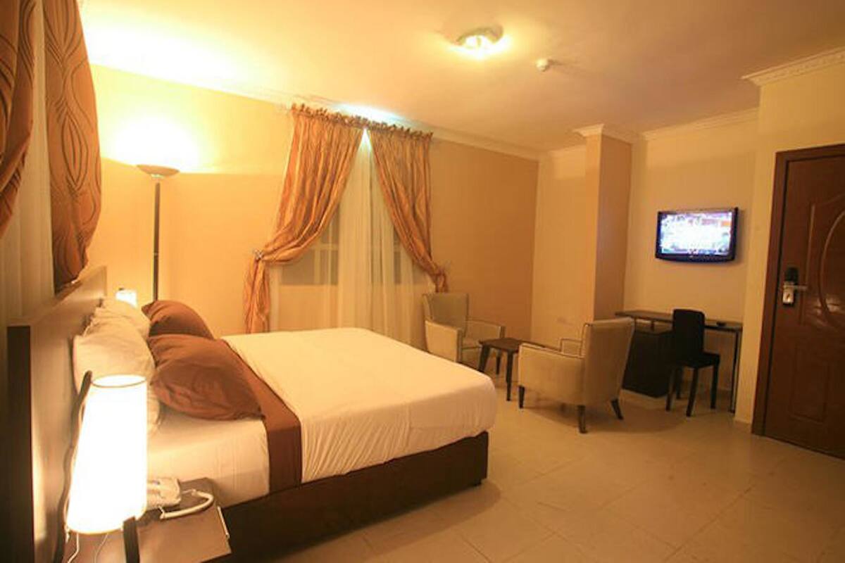 In-room safe, desk, laptop workspace, bed sheets