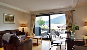 Apartment, 1 Queen Bed | Living area | 30-inch TV with digital channels