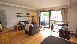 Apartment, 1 Queen Bed | Living area | 30-inch TV with digital channels