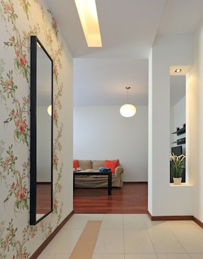 Appartamento, 1 camera da letto, vista città | Area soggiorno | TV a schermo piatto