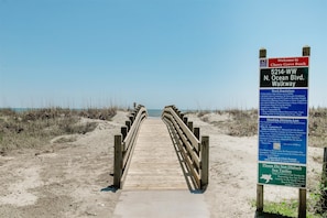 A wooden boardwalk leading to the beach with a sign indicating 'Welcome to Cherry Grove Beach' and 'N. Ocean Blvd. Walkway'. - Cherry Grove 206 Villa Villa 6 (North Myrtle Beach)
