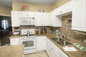 Villa | Private kitchen | Fridge, microwave, oven, stovetop