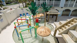A water play area with a wooden structure and a staircase. - Myrtle Beach 201B Villa Villa 4 (Myrtle Beach)