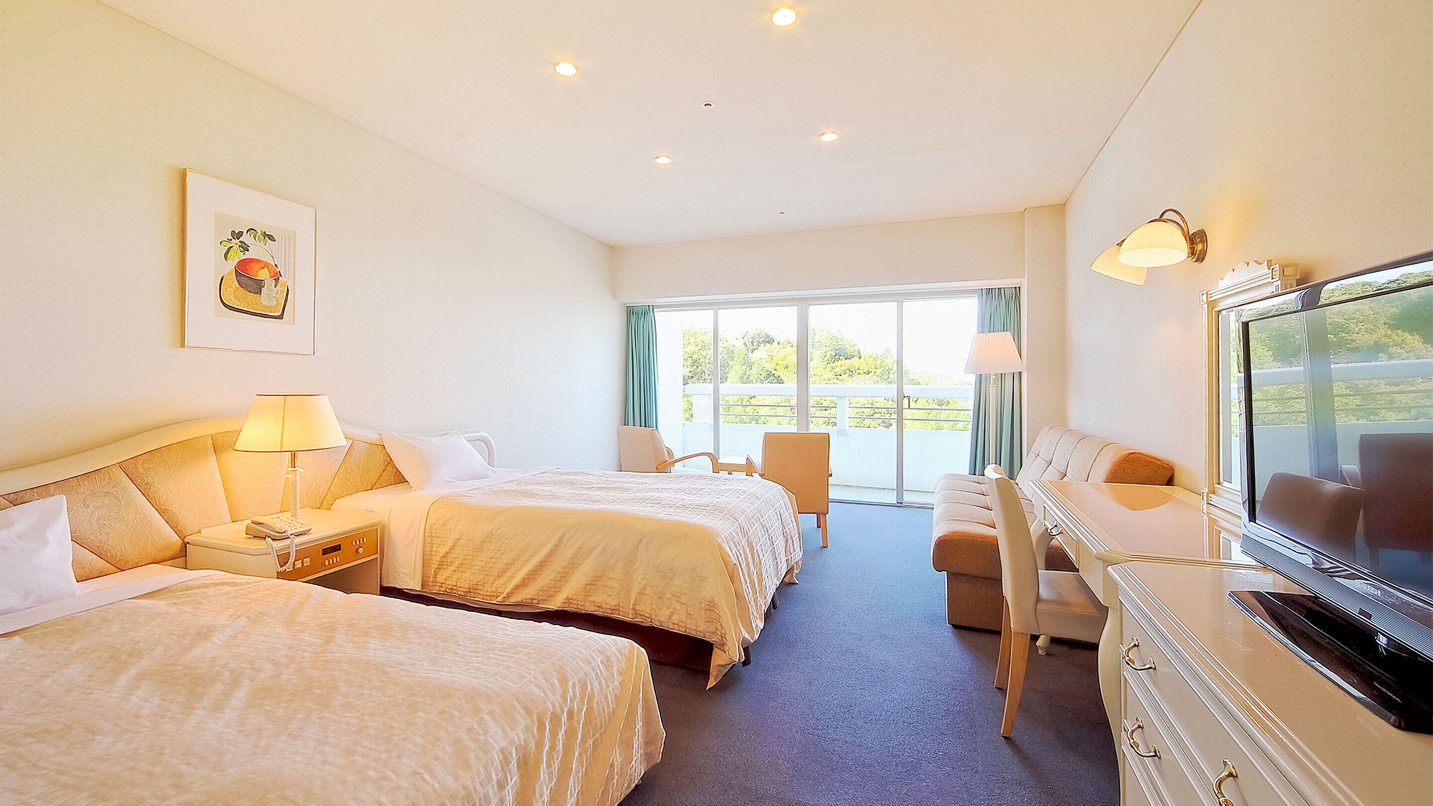 A hotel room with two beds, a desk, a chair, a television, and a window with a view.