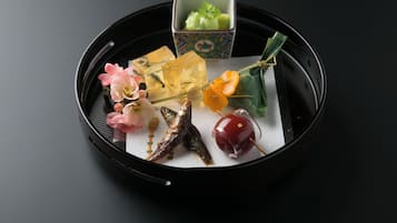 A tray with various food items and a small box.