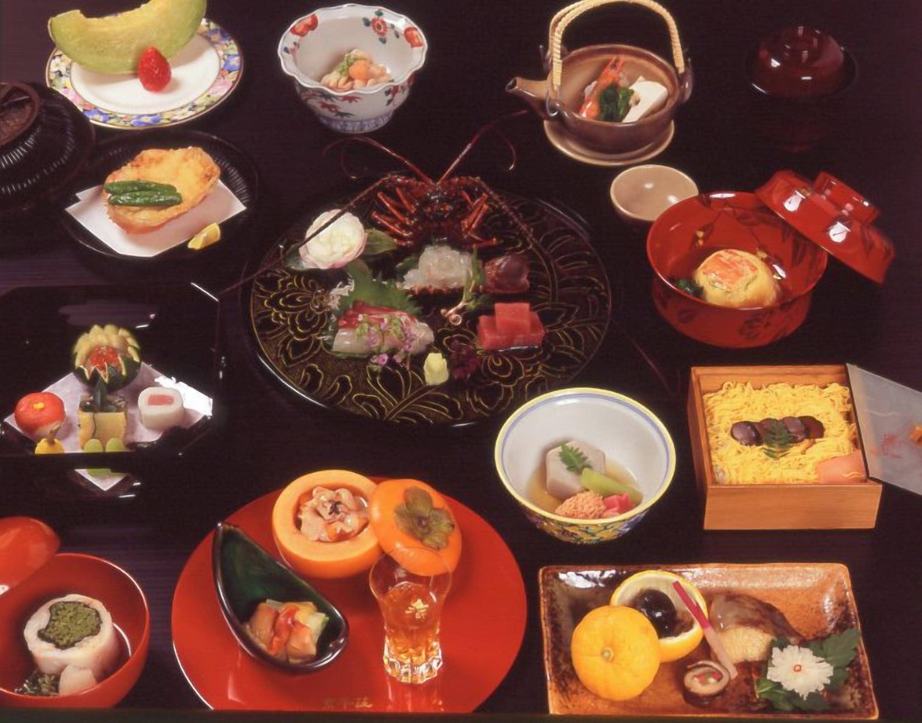 A variety of dishes and bowls on a table, suggesting a meal setting.