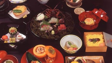 A variety of dishes and bowls on a table, suggesting a meal setting.