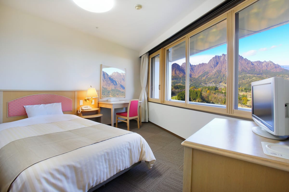 Standard Single Room, Mountain View | In-room safe, desk, laptop workspace, blackout drapes