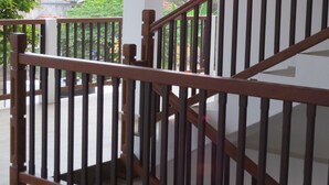 A staircase with wooden railings leading to an upper floor. - Sailors Mirissa (Mirissa)