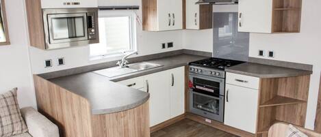 Fridge, microwave, toaster, cookware/dishes/utensils