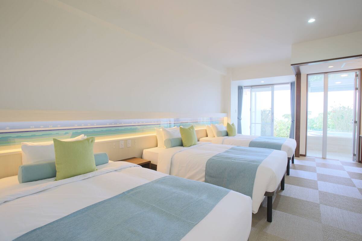 triple room, multiple beds, partial ocean view | in-room safe, soundproofing, free cots/infant beds, free wifi