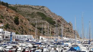 A marina with numerous boats docked, a rocky hillside in the background, and a building with a sign that reads "Club Nautico Jalea". - Spacious villa, close to Denia, Pool 10m x 5m, great views, A/C, fast wifi 500mb (Alicante)