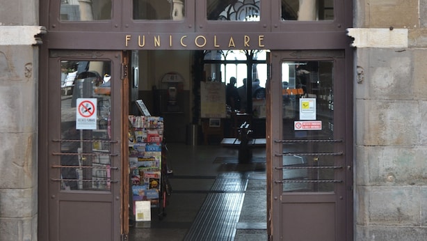 A stone building with a brown arched entrance labeled "FUNICOLOARE." - NEW APARTMENT in the heart of Citta 'Alta (Bergamo)