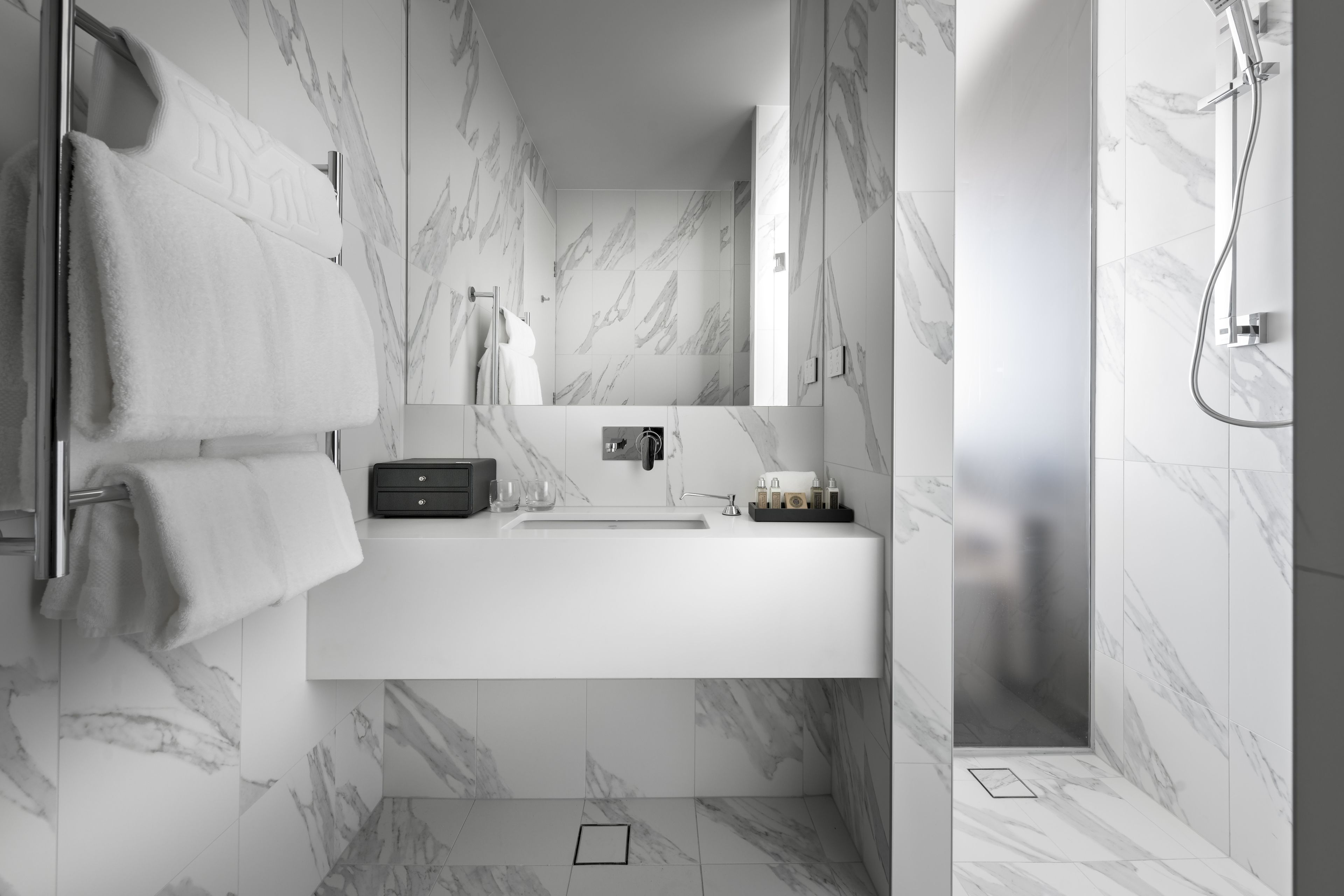 premier suite, 1 king bed | bathroom | designer toiletries, hair dryer, slippers, towels