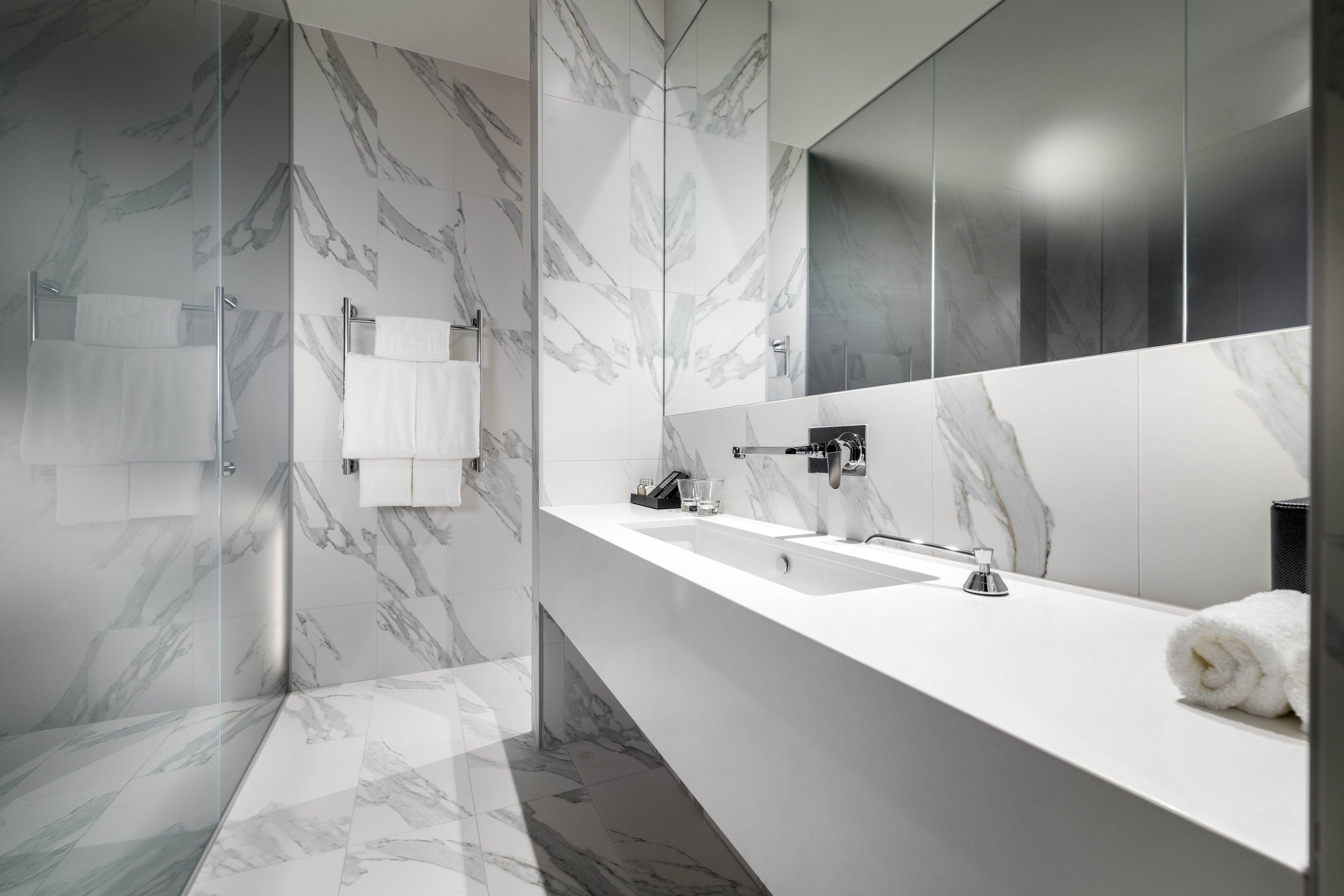 courtyard suite | bathroom | designer toiletries, hair dryer, slippers, towels