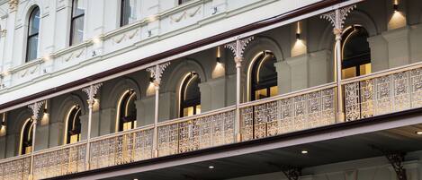 A building with ornate balconies and arched windows.