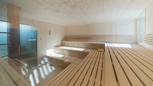 A modern interior with wooden slatted flooring and a glass partition.