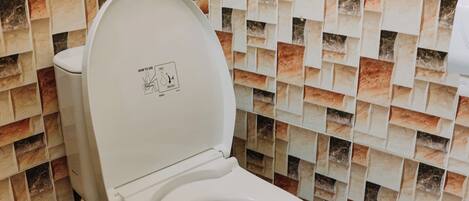 A toilet with a sign above it stating "OTHER ITEMS INSIDE THE TOILET!!".