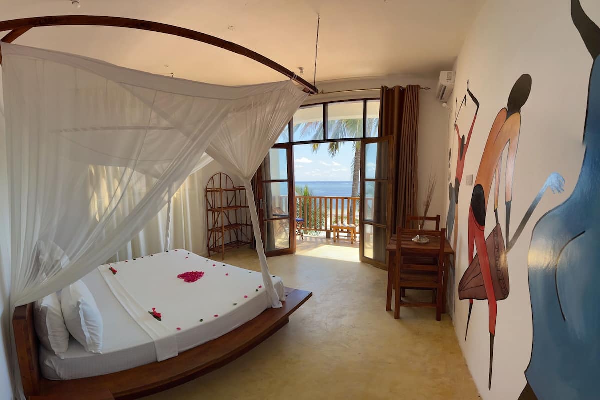 Deluxe Double Room, 1 King Bed, Sea View | 1 bedroom, rollaway beds, bed sheets